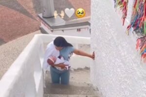 mae-sobe-escadaria-de-igreja-com-filha-nos-bracos-apos-bebe-sobreviver,-no-ceara