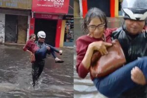 mulher-e-levada-nos-bracos-para-atravessar-rua-alagada-no-centro-de-fortaleza